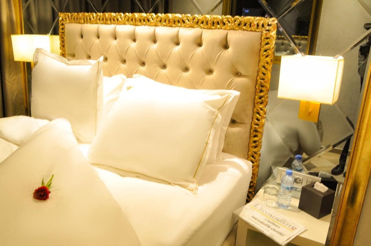 Suite Hotel Casa Diamond Casablanca Bagian luar foto A bed at the hotel